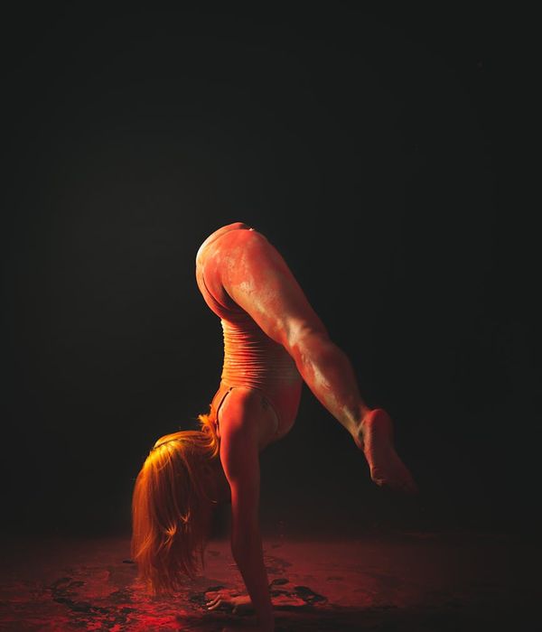 Woman in a graceful yoga pose emphasizing fluidity and joint movement.